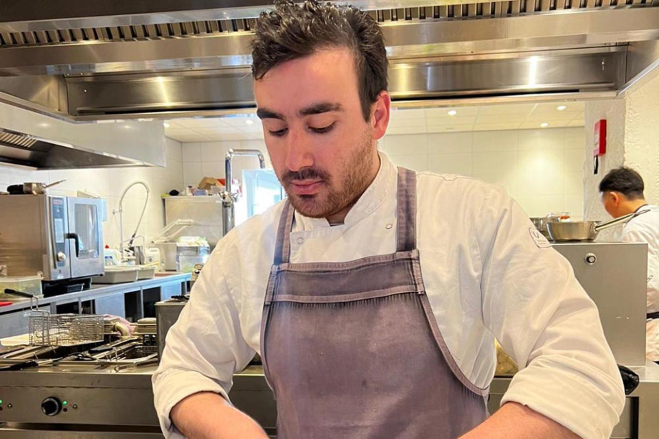 Ahmad Mohammad at work in a kitchen.